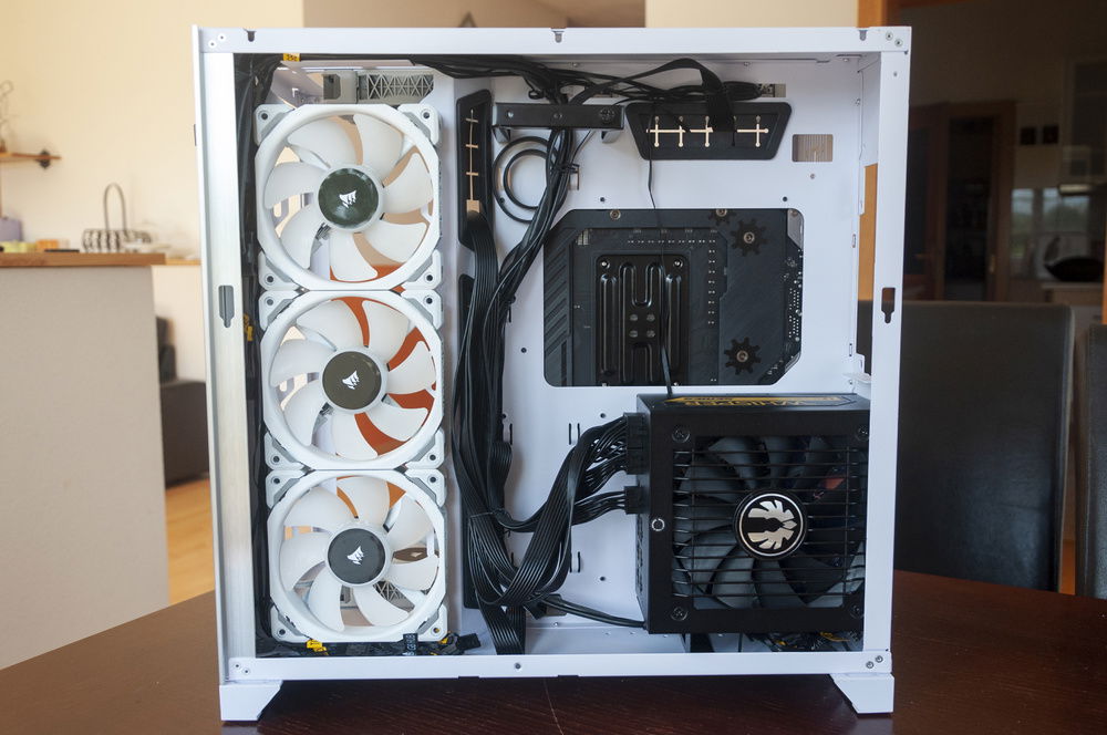 Finally, the PSU and those horrendously stiff BitFenix cables could go in. Routing, binding and managing those cables was a pretty big pain.