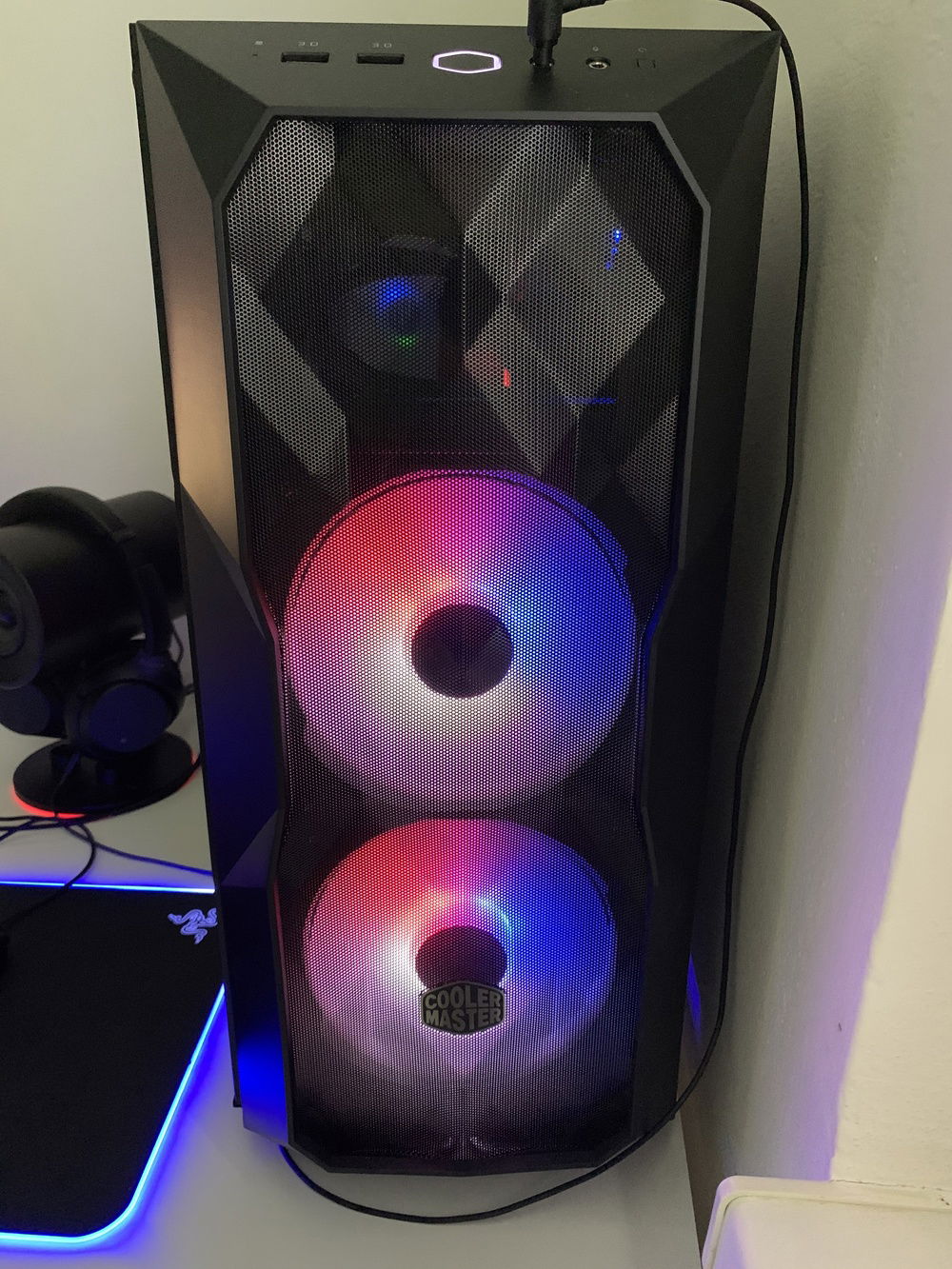 Intake fans, spinning 3 colors. As the case is made for 360mm setup, you can see inside through the mesh.