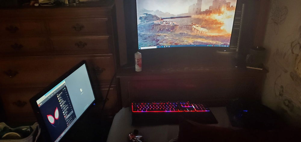 I don't have room for a nice desk so its set up to the end of my bed on a dresser.