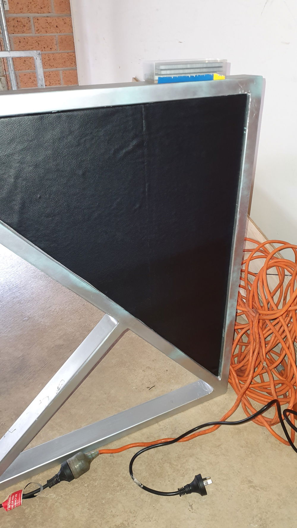 First panels covered and drying wrinkles are worked out with heat pressure