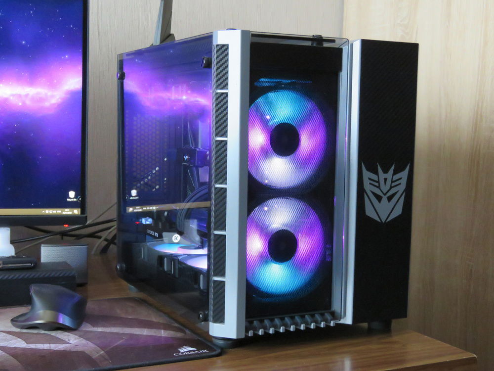 Build in a 280X, spraypainted gray with carbon wrap masking revealing the decepticon logo in the front.