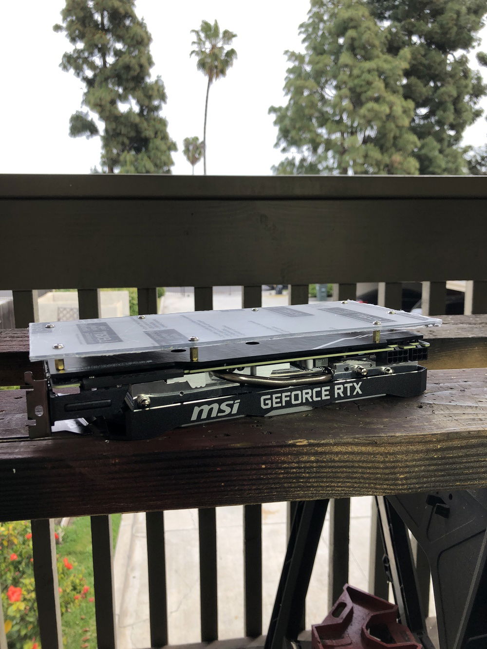 Mounted the video card like a motherboard after drilling holes and inserting screws inside it’s backplate