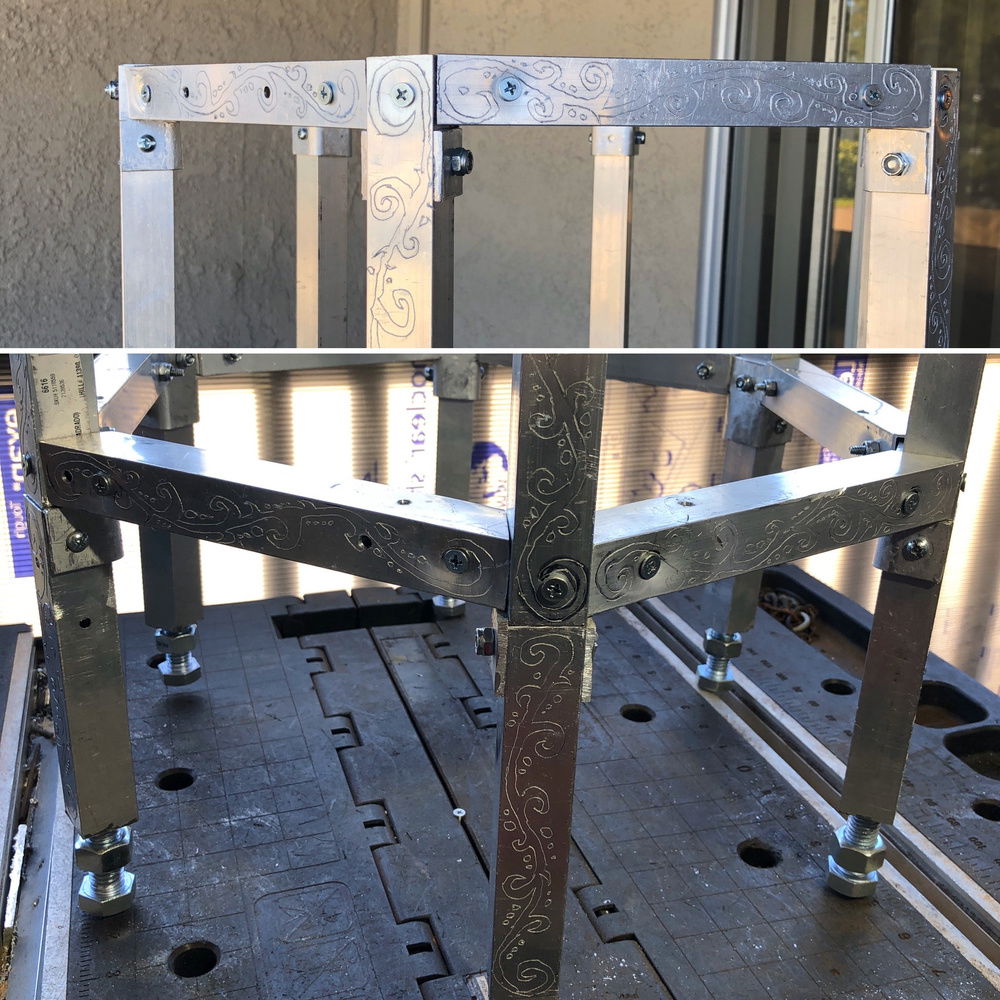 Engraved scroll pattern on the outward facing surfaces of the square pipe aluminum case frame