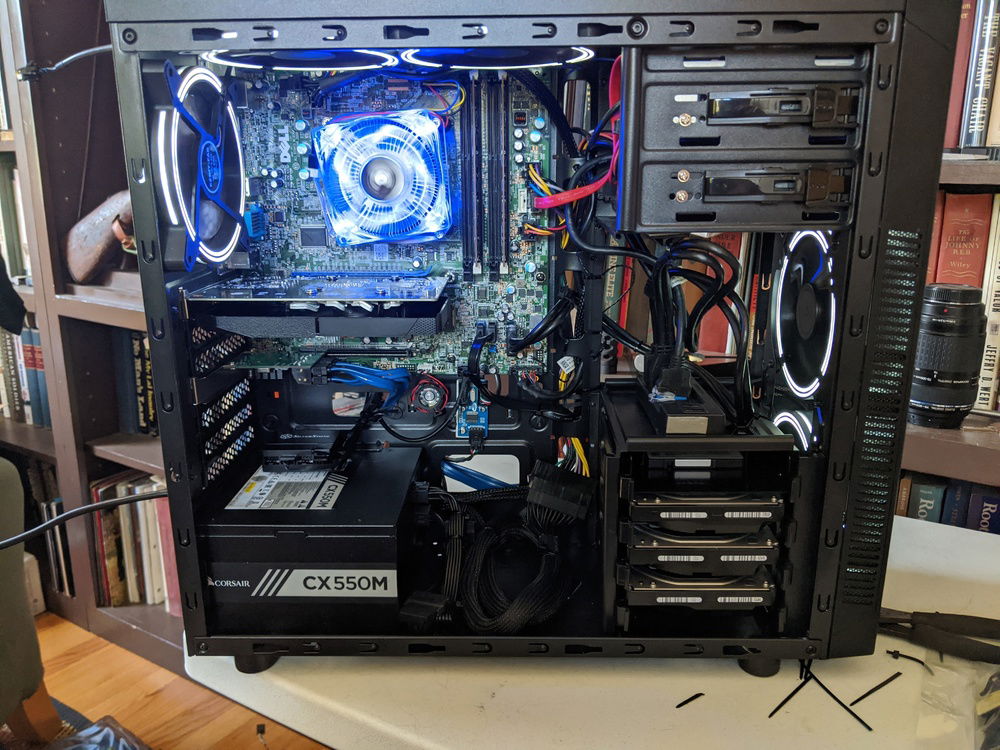 A shot with the fans running.  Let there be a great amount of light!  The 120mm fans are EZDIY-FAB white fans (have apparently dried up).  In these pictures I have a  Nvidia GeForce GT 1030 OC 2G GPU installed instead of the ATI AMD HD 5850.