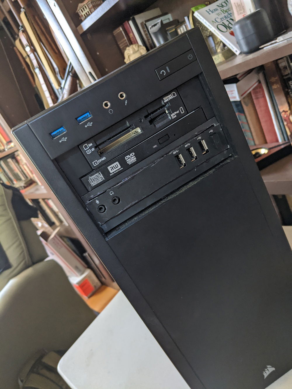 My kludged up front panel.  I surgerized and modified the Dell OEM front panel and JB welded it into a plastic 5.35" drive adapter.  I need to putty it and paint it, but I haven't yet.  Everything is functional.  I wanted to have the diagnostic LED lights.