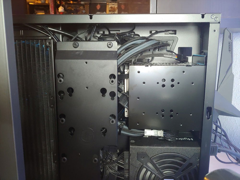 Back panel off. SSD plate covers the mess. Between cable extentions and a poorly designed fan/rgb hub that came with the fans, and leaving the radiator uncovered there's actually a lot less room than you'd think.