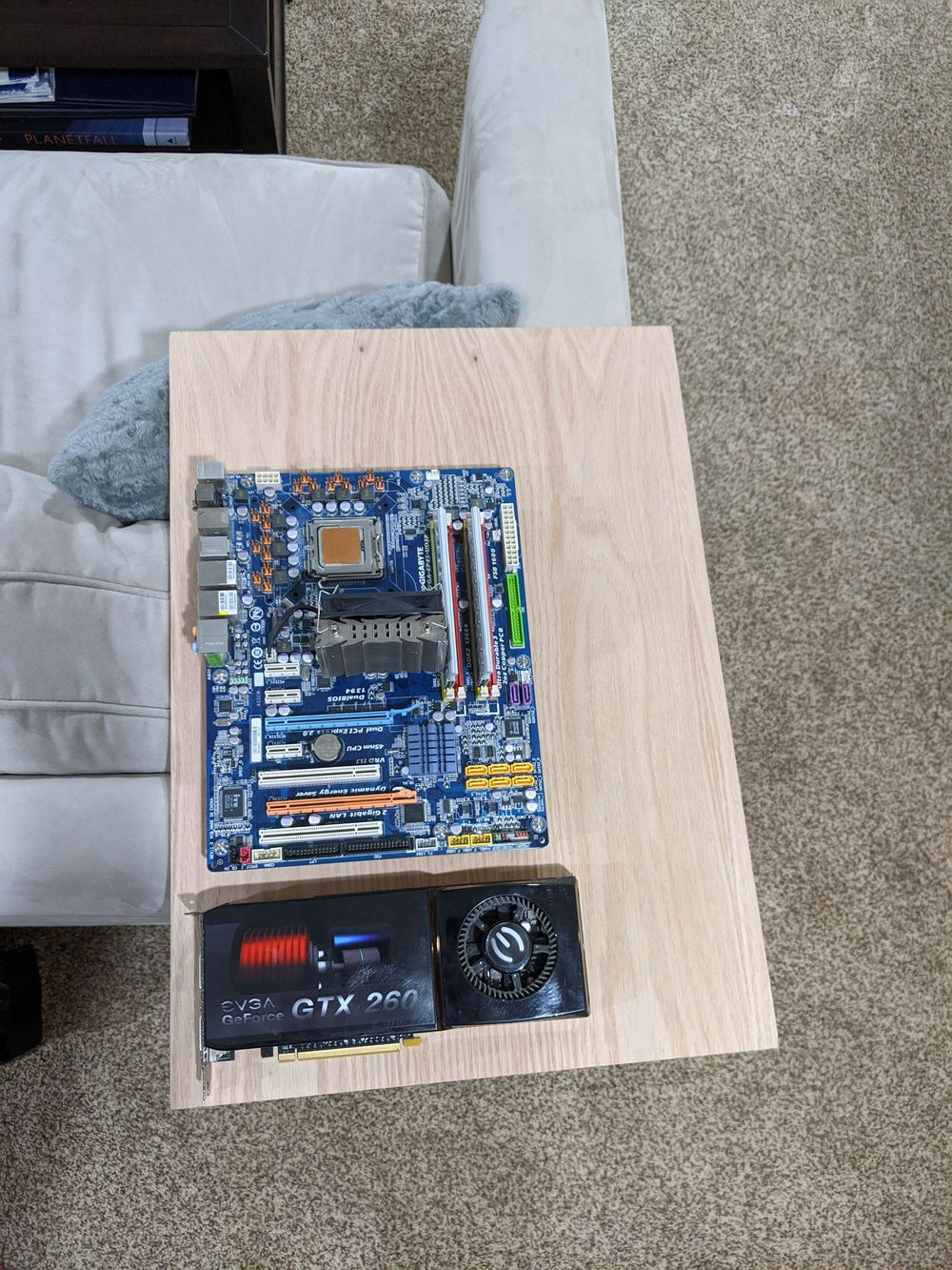 A picture for scale, this is an standard ATX motherboard and an old GPU. There are about 6 inches on the top and bottom of the motherboard and it is offset an inch from the left edge.