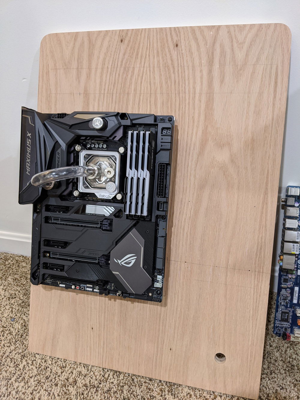 Motherboard is mounted and is square to the back piece of plywood. Now to start measuring the location of the ports.