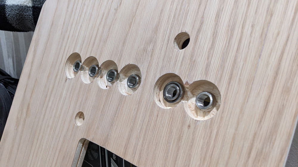 From the back. I need to grinds down a little so the washer can be screwed down. I didn't go quite deep enough with the 1.5 in drill bit.