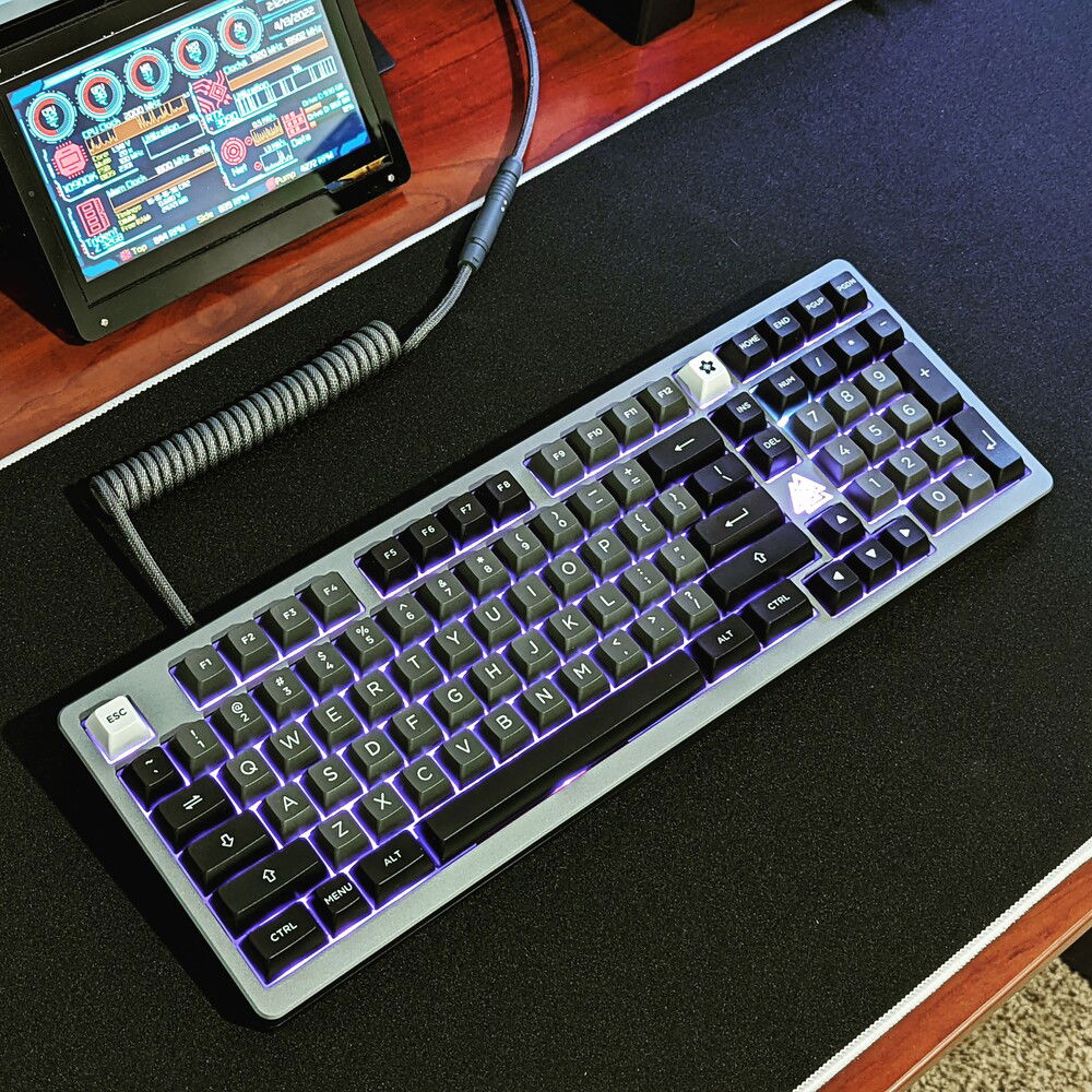 My custom keyboard, KBDFans Odin. I'm using Tecsee Ice Candy switches and Akko Silver and Black keycaps.