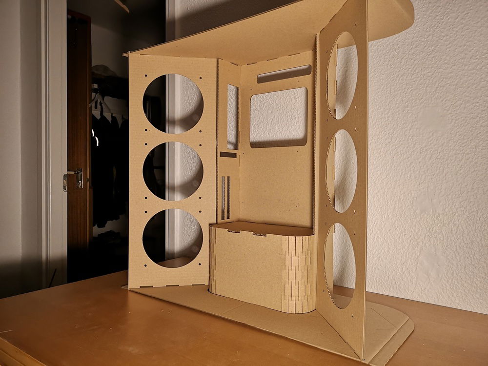 Here is the cardboard prototype assembled. It is full size so I can start fitting older PC parts. The video card will be vertically mounted and I need one small PCI-slot for my FW card that controls my sound card.