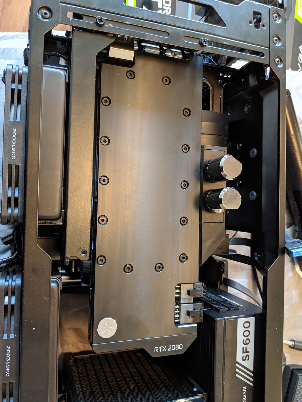 Installed EK water block on the EVGA 2080 Super. This is a ridiculously tight fit on the PSU cables for the GPU, and this isn't even off label use. The rad is the same thickness as the fan that was factory installed there.