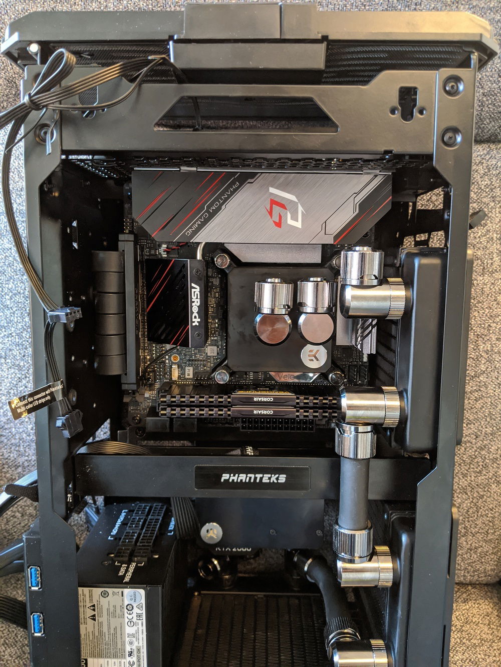 Test fitting motherboard. There is no way to get a soft tube from the CPU block out to the top of the first rad. This is going to require some case modding
