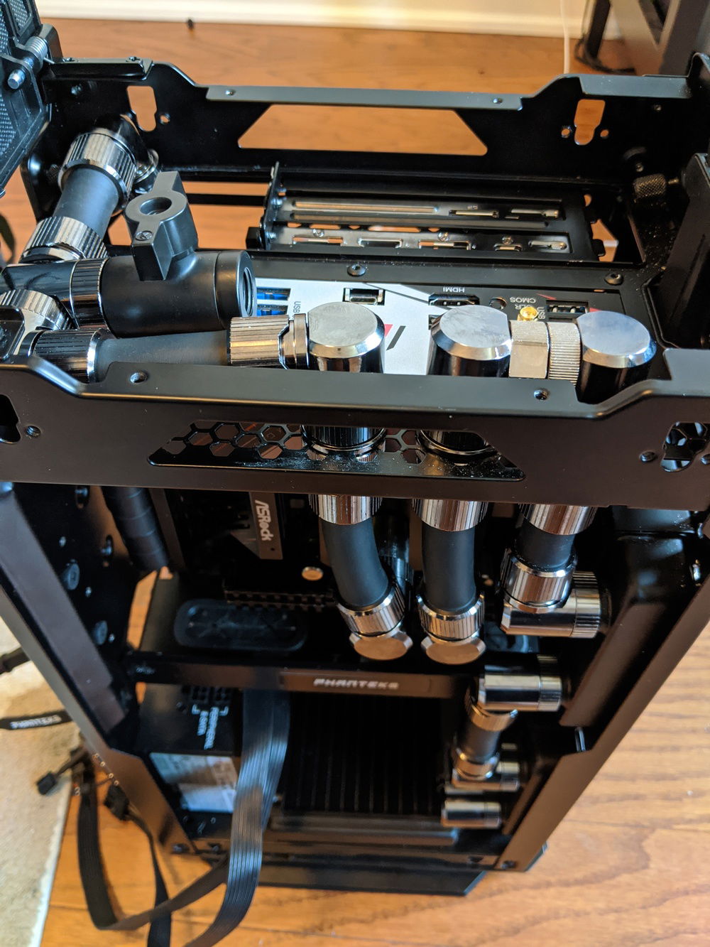 Complicated routing to fit so many radiators in this case. Holes drilled in top grill