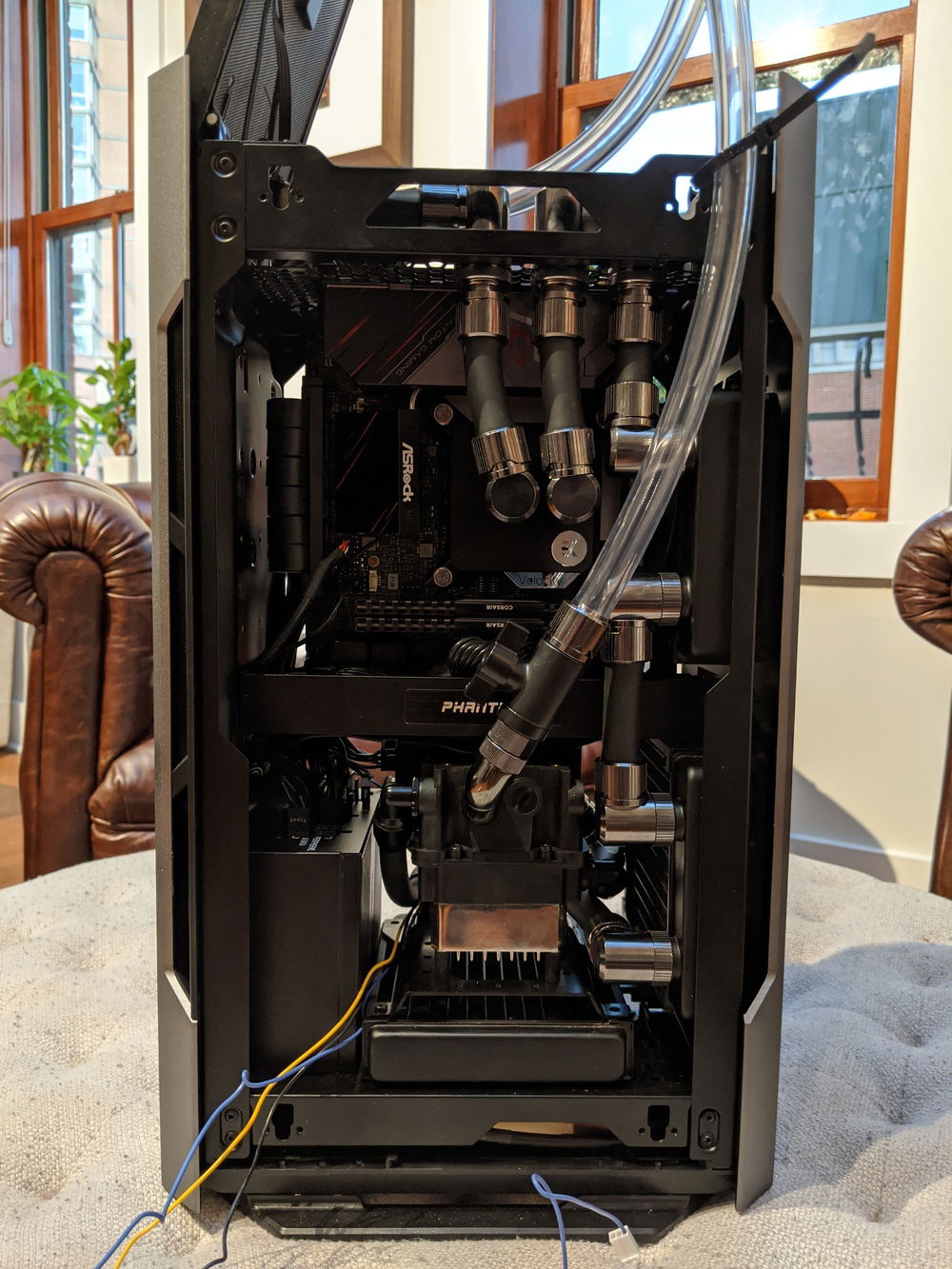 The pump is here! Just fits, though not in the orientation I'd planned. Also no room for standard fittings, so I'm using low profile alphacool fittings. They're designed for narrower gauge tubing, so the tubes in and out of the pump are a little narrower than the rest of the build. Should be fine I think