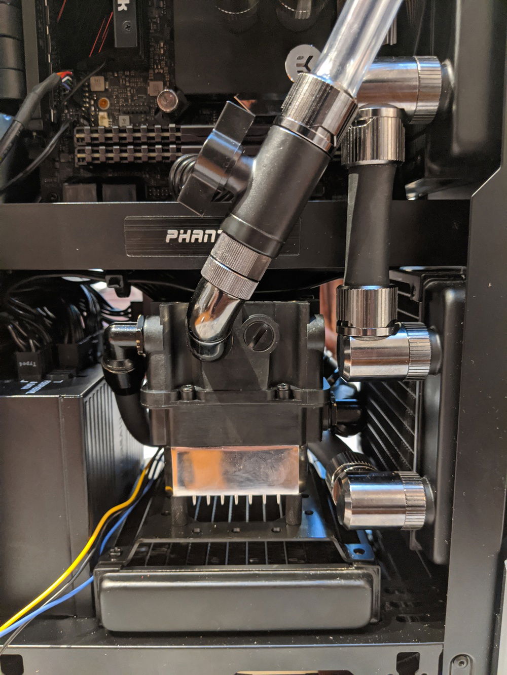 The pump res combo from alphacool. Ddc pump. left fitting is inlet from bottom radiator, right fitting is out to GPU in