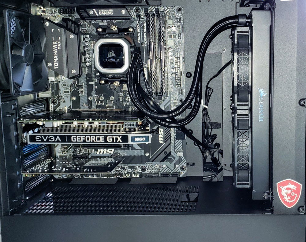 Finishing up cabling of the GPU and front panel, but all the hardware's in at this stage. Fans are mounted push/pull on the rad and temps stay pretty solidly in the upper 40's on the CPU package.