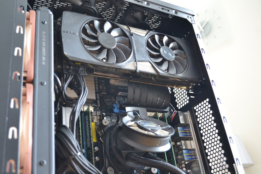 The GPU just about fits. It is supported by a ziptie-contraption and some foam behind it against the PCH heatsink. 
I am sacrificing some looks for space saving. Old photo.