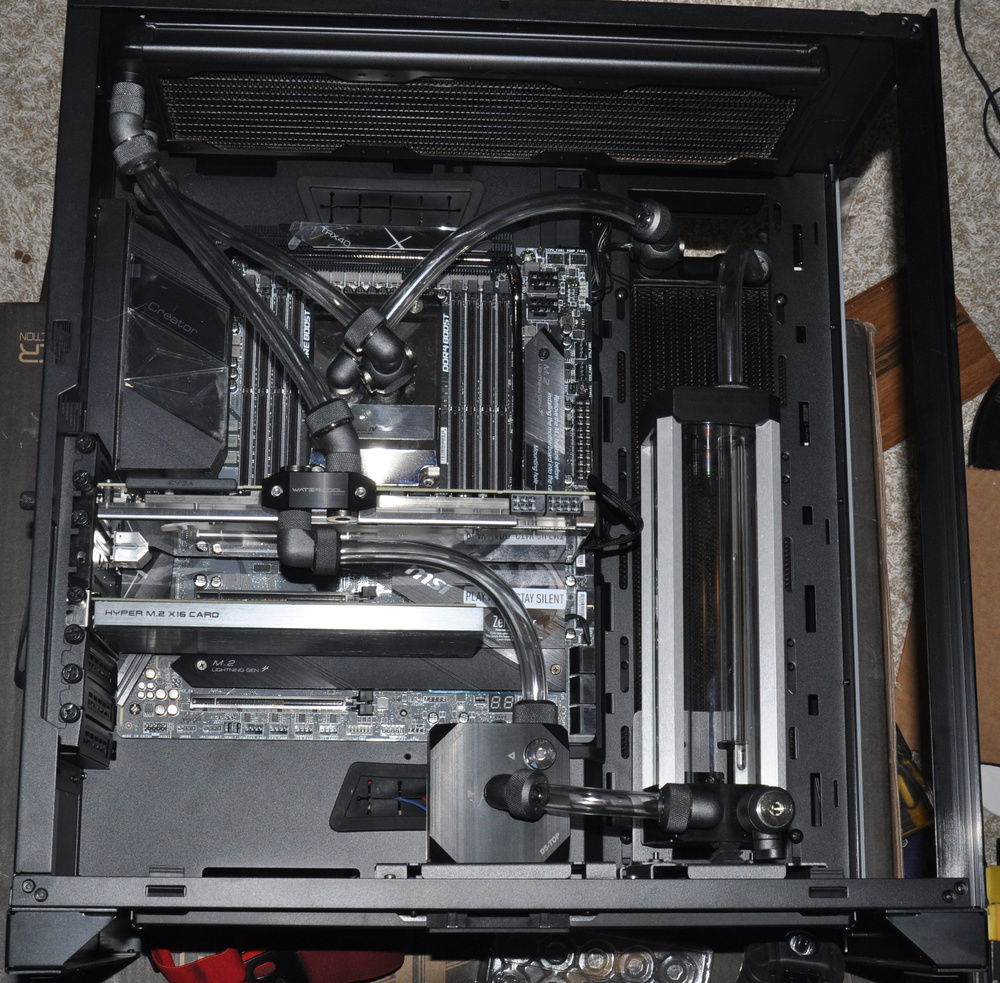 Plumbed with horizontal radiator I/O ports located at top left.