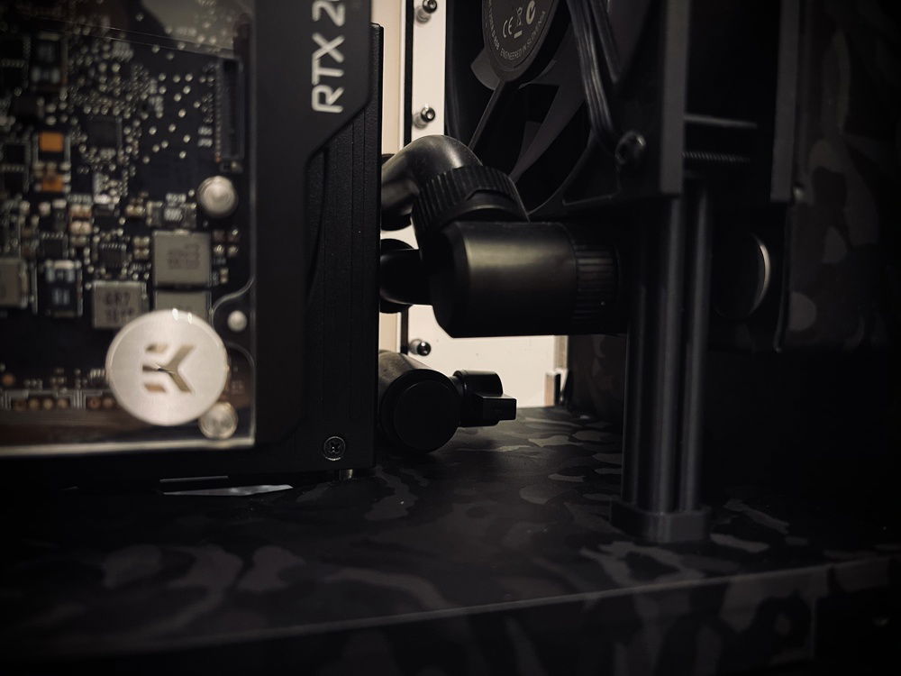 Closeup of bottom radiator custom matte black tubing.