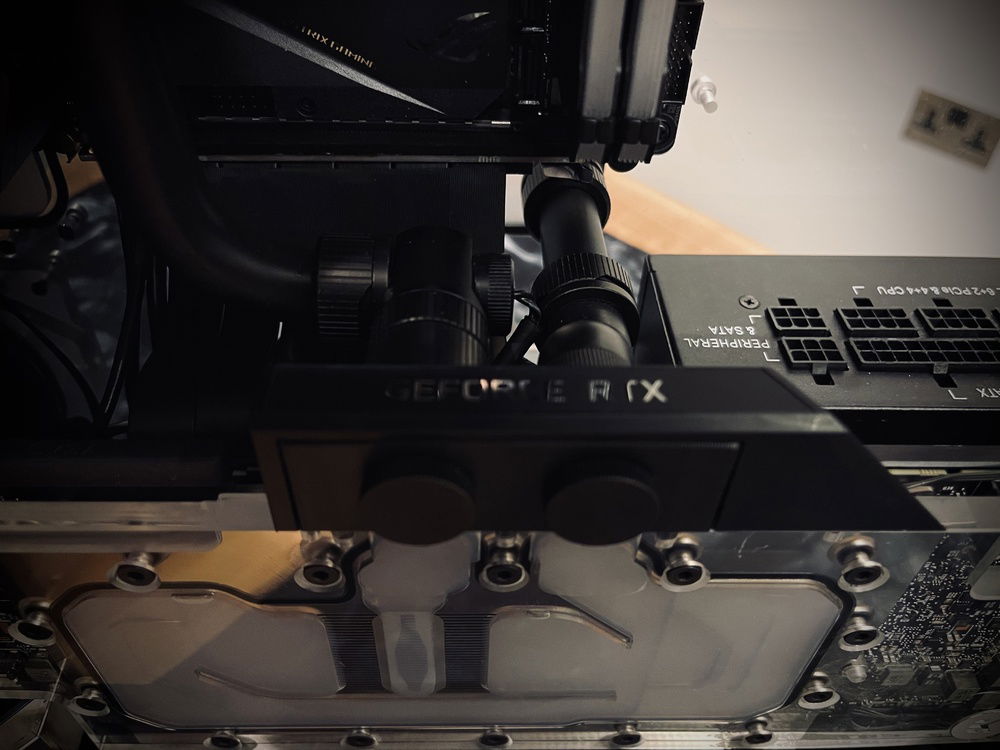 Closeup of RTX 2080 TI waterblock tubing with inline temp sensor.