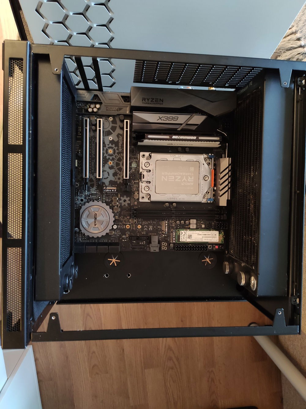 first testfit for the radiators and the motherboard. fitment in this one was pretty critical, the bottom fan headers and such on the motherboard are actually touching the radiator.