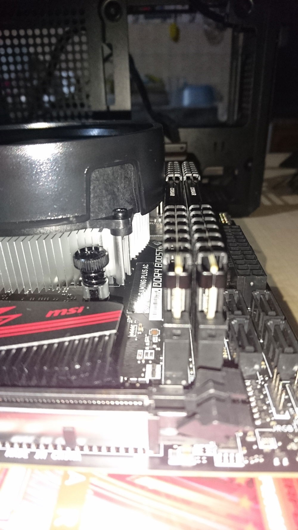 The cooler shroud is pushing the ram. Decided to remove it.
