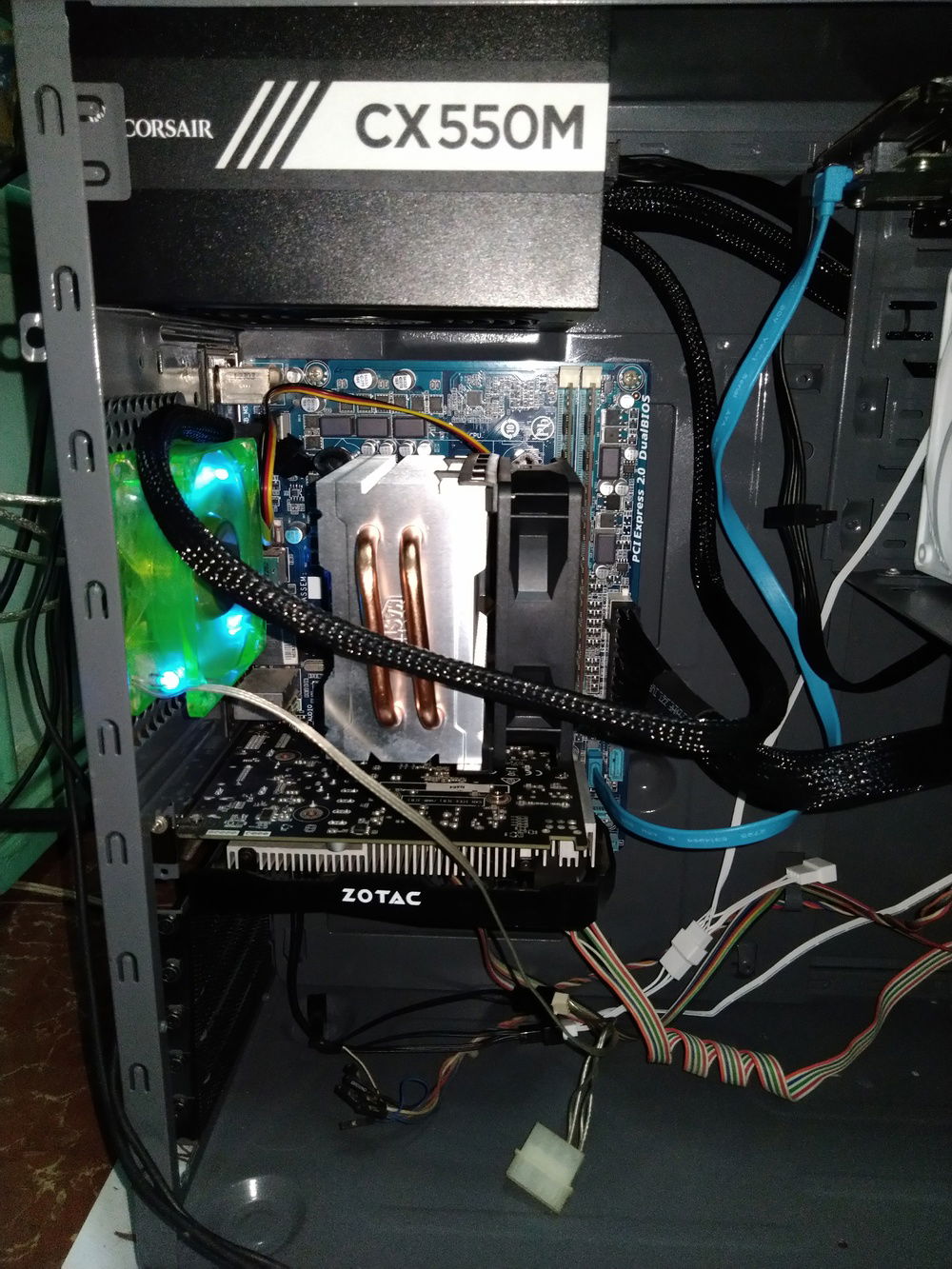 There was a plan to change the CPU cooler's fan into a PWM type. However, it was realized that the fan's high RPM mean that it blows more air to the heatsink, therefore dissipating the heat faster. The plan was cancelled and instead, the DeepCool exhaust fan (the green one on the left) was replaced by a more powerful one because sometimes the former requires manual cranking on PC start.