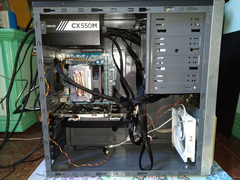 My current build. Cable management is almost impossible due to the design of the case. Removing the fan on the 5.25" bay will make a room for the cables but  it doesn't need to as my pressure-optimized fan could move large volume of air going to the PSU, despite the obstructions created by cables.