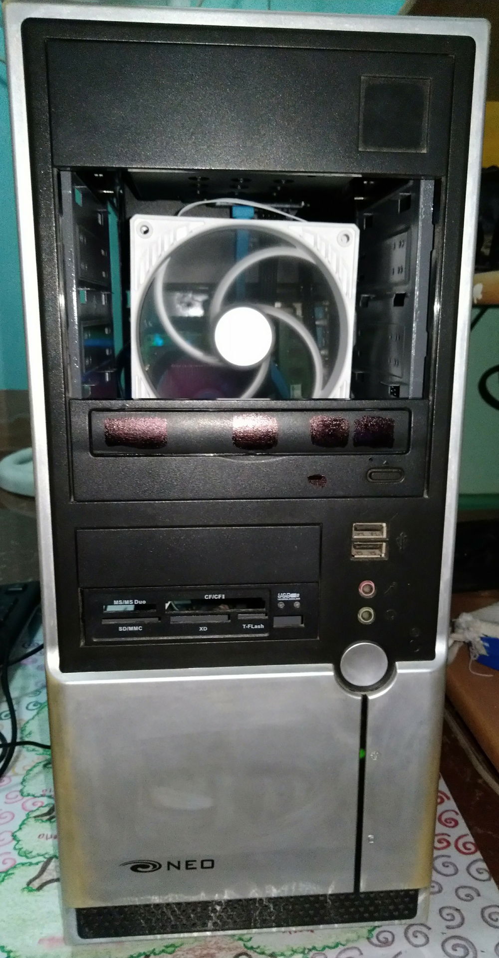 Front fascia after the modification. Two 5.25 inch panels were detached to make holes for a direct source of airflow.