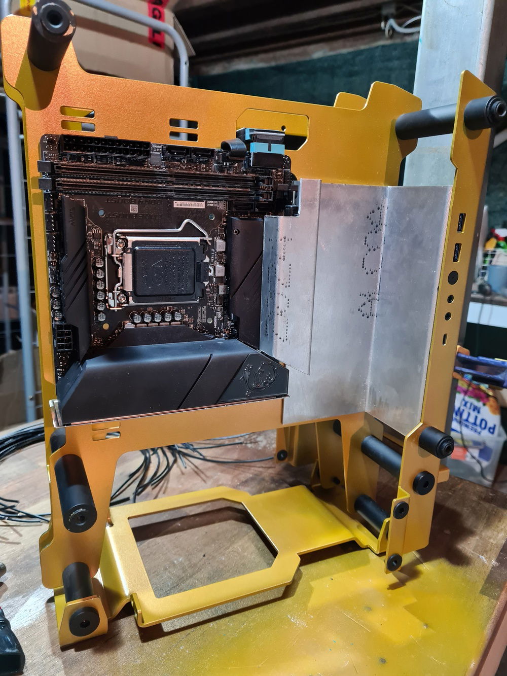 cover plate for PCI ribbon cable and front panel cables made from aluminium sheet.