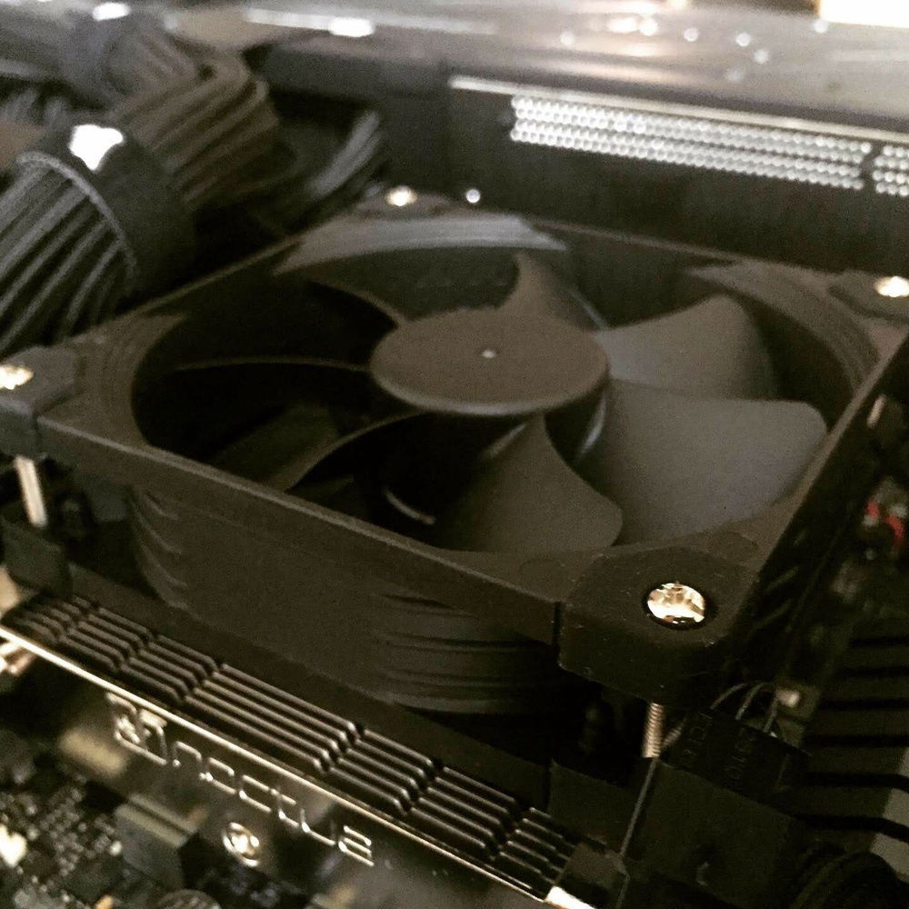 Swapped out the included 92mm slim fan for a 25mm thick Chromax fan.