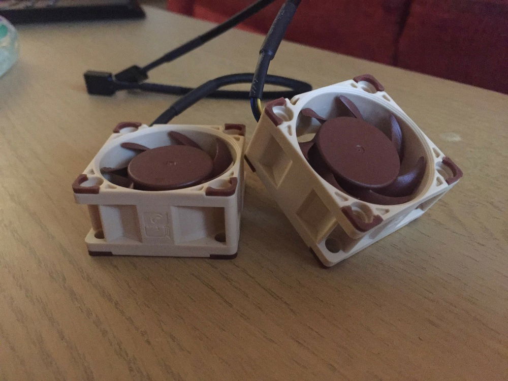 Added these two Noctua NF-A9x20 PWM fans to help exhaust air from the main chamber of the case.  They're attached to the case with blu-tac for the time being.