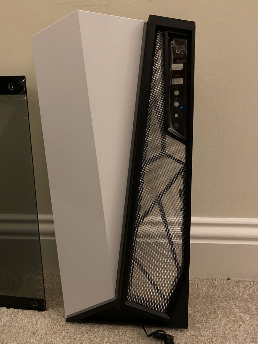 Took the glass out of the front panel then girlfriend helped out with stencilling it onto rodent mesh that I got from Amazon then cutting it. Looks good, probably going to paint it tomorrow then glue it back onto the panel.