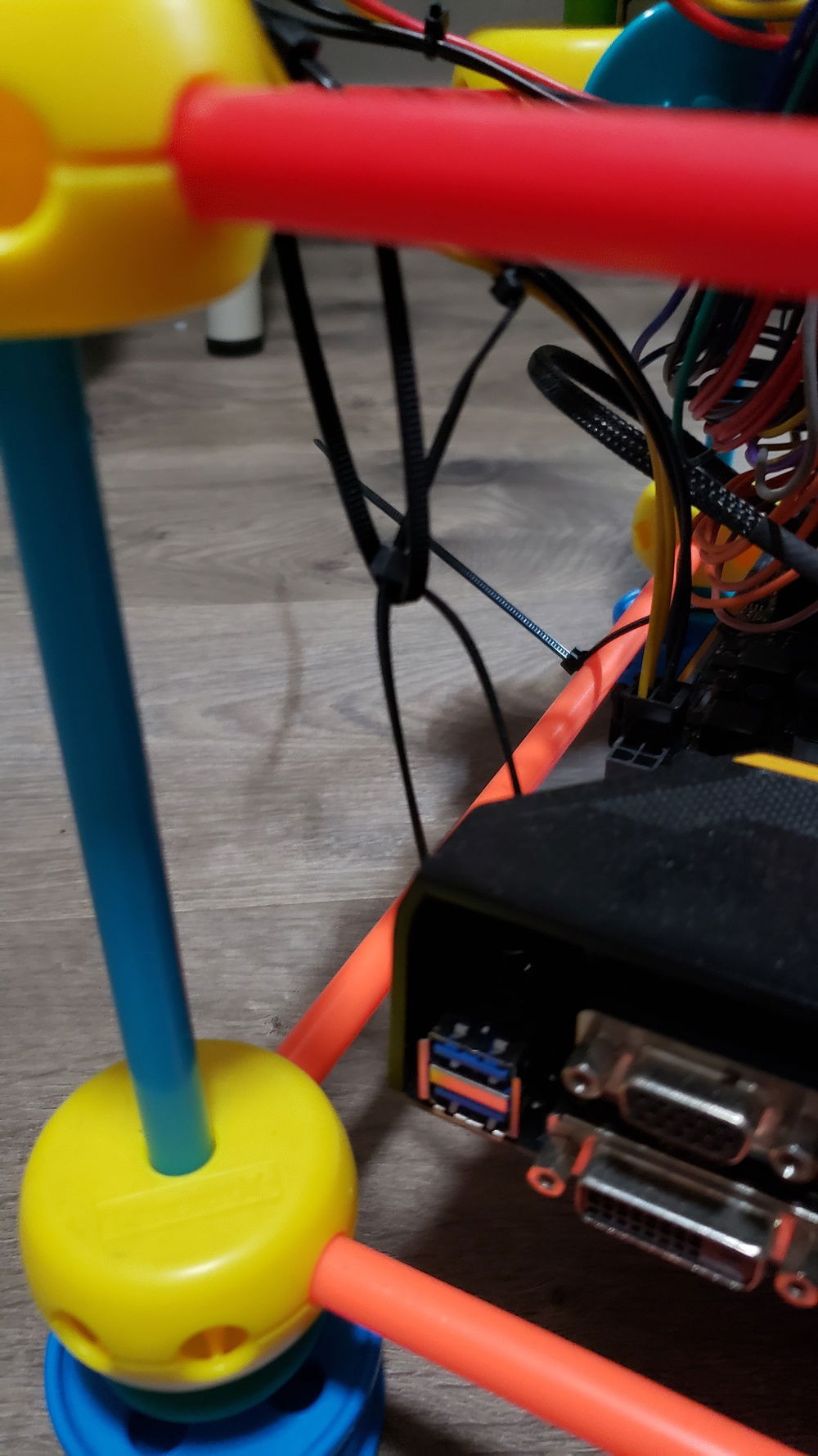 I used zip tied zip ties to connect the motherboard to the case (tinker toys)