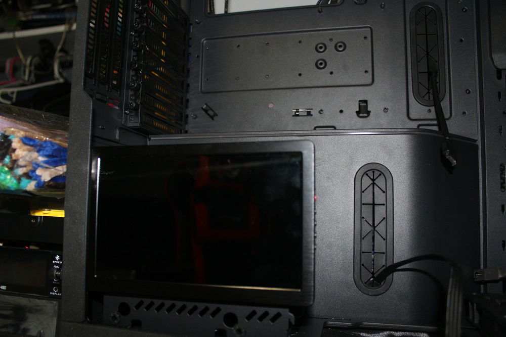 7-inch system monitor attached to the case's hard drive bays for 24-7 monitoring (Initial concept).