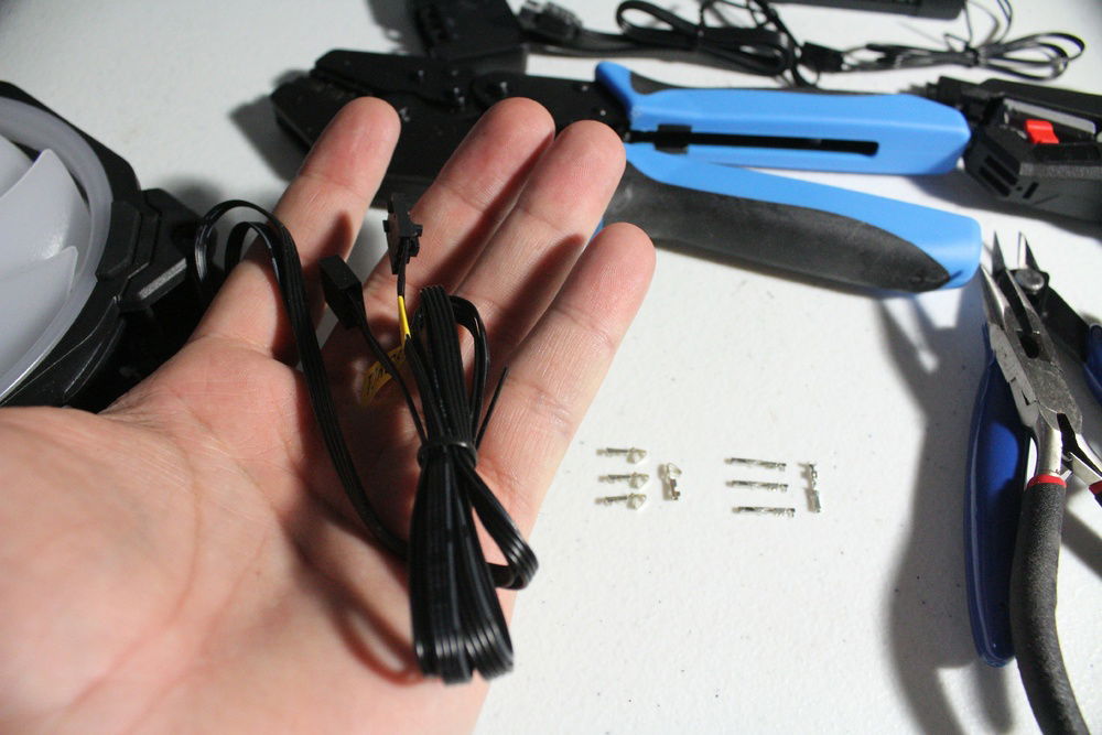 Preparing to cut the cables and start the modular fan process.