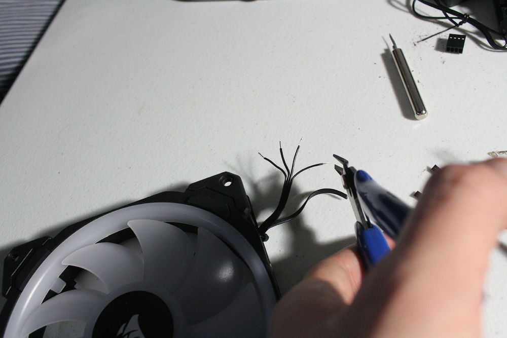 Making adjustment to any imperfections when stripping cables in order to keep them the same length etc.