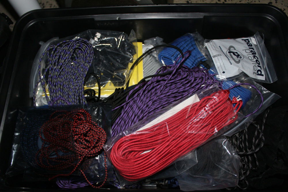 Crate full of paracord for custom sleeved cables.