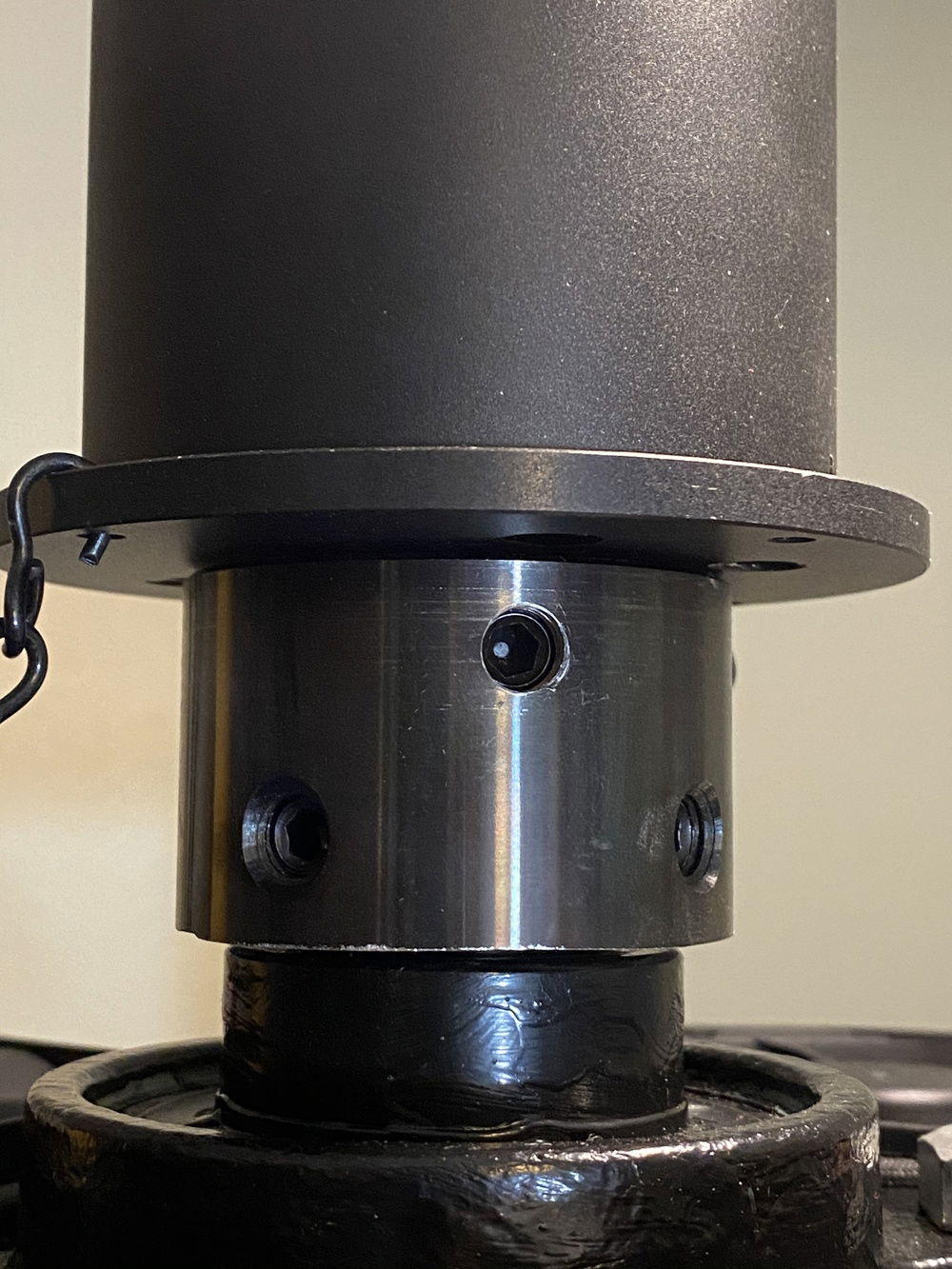 Heavy rolled steel shaft clamp keeps the rotor side of the slip ring rotating with the drive shaft