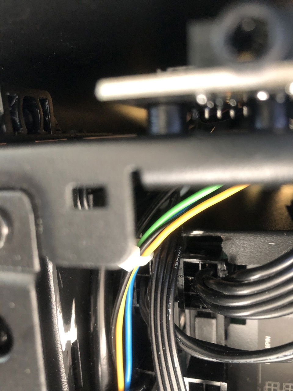 Small cutout in PSU cage necessary to accommodate Silverstone's protruding female connectors