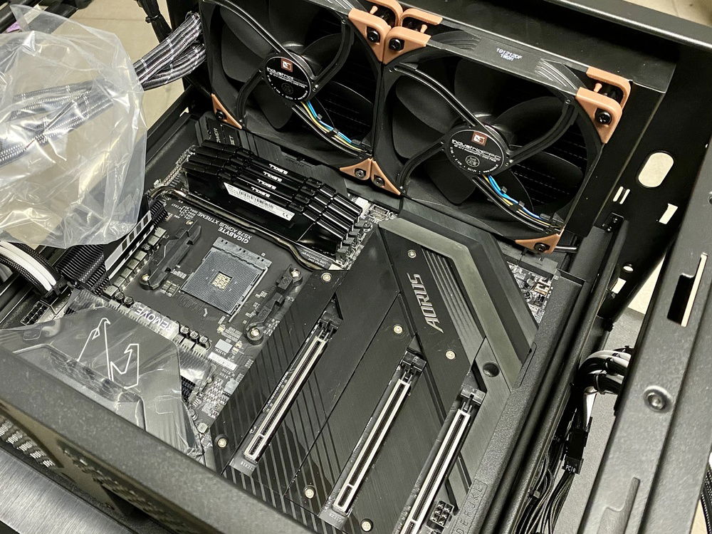 Tight fit but the fans and CPU AIO are actually clearing the EATX motherboard.