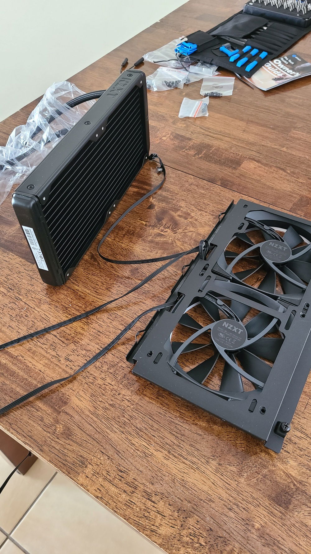 Putting the radiator together with the front fans and case bracket