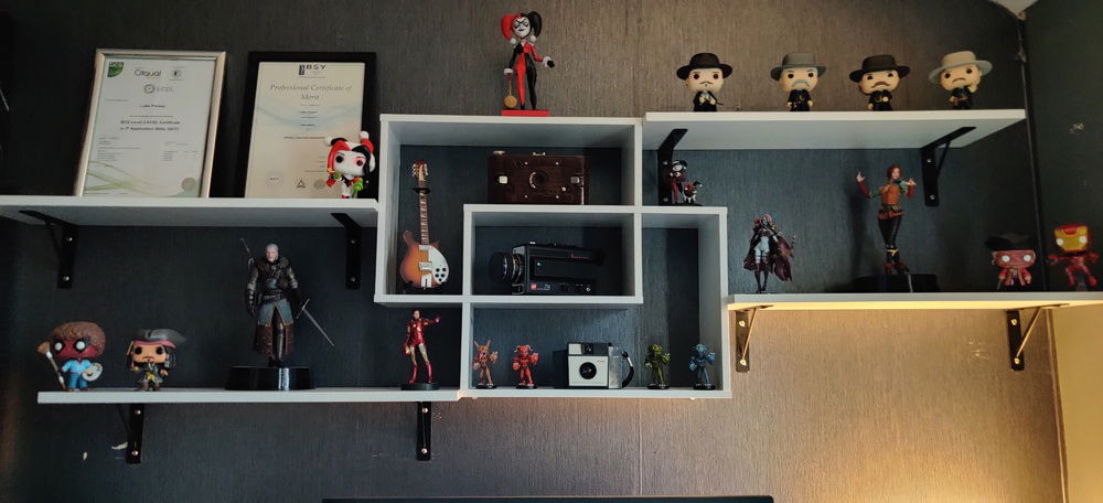 Above the monitor.