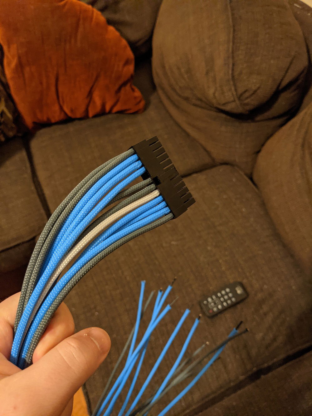 A closeup of what I have so far for the 24-pin ATX cable. I've sleeved everything here except for wires that need to be split into 2 wires down at the PSU end. Going to save that for later and knock out the simpler stuff first.