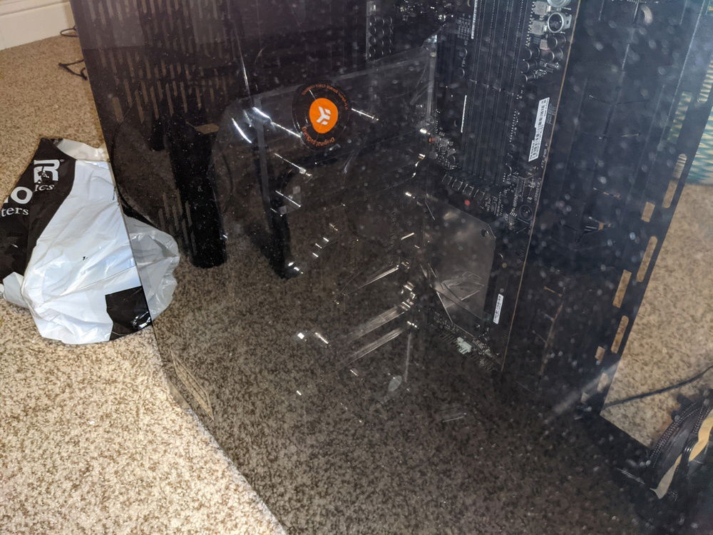 It's hard to see in this picture, but the glass panel barely fits (the terminals are touching the glass) when I just rest the GPU block flush against the motherboard. Likely won't fit after the block is installed on the GPU.