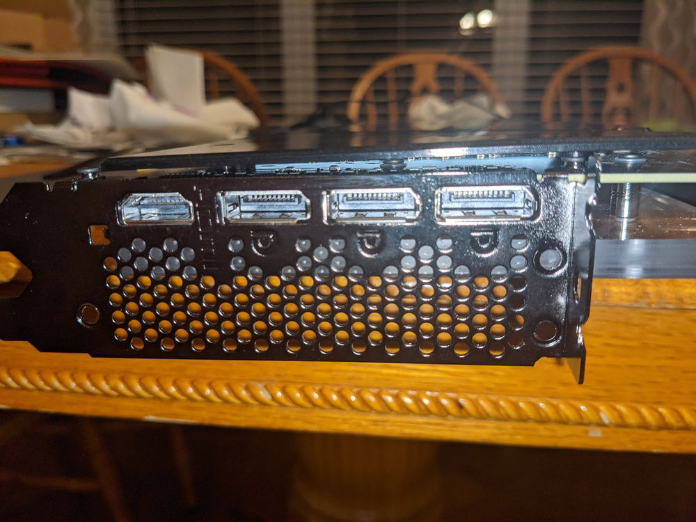 Having some trouble getting the EK backplate to attach flush to the card, due to how the I/O shroud attaches to the card.