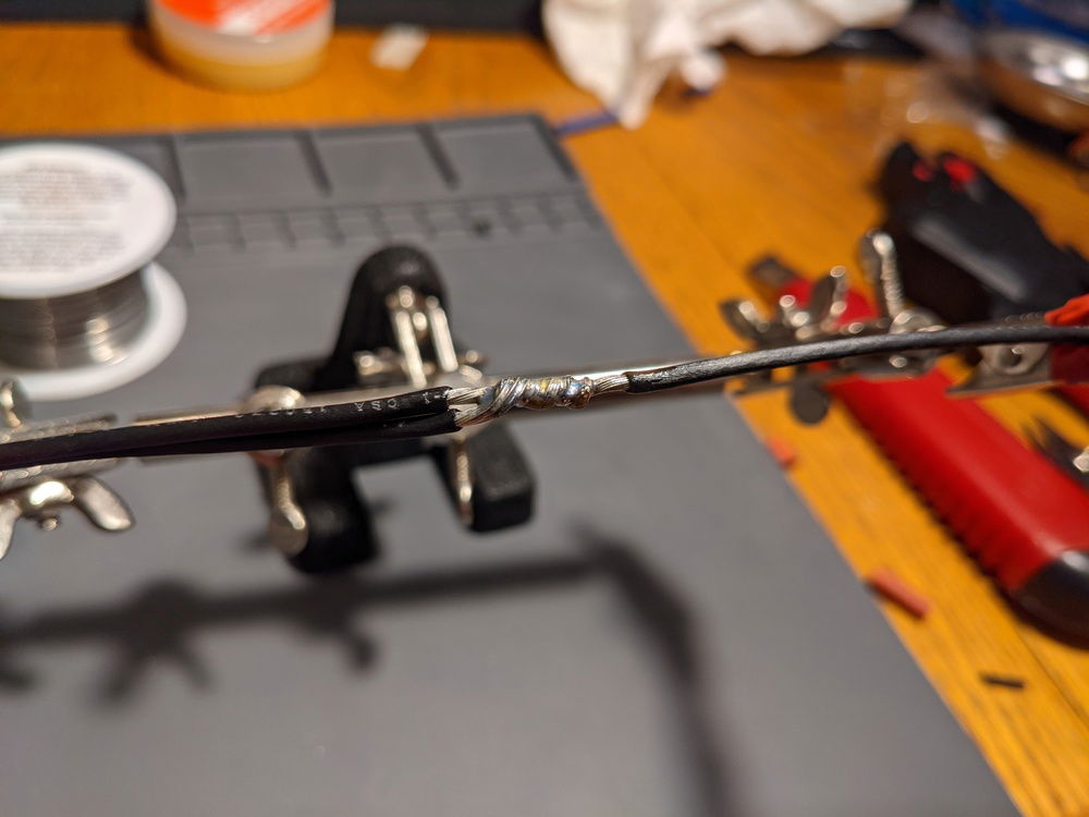 Soldered the wire. I'm not an expert, but I made sure to heat the bottom of the wire with the soldering iron, and then let the solder fall into the strands of the wire from the top. I think the joint turned out pretty decent, especially for a first timer!
