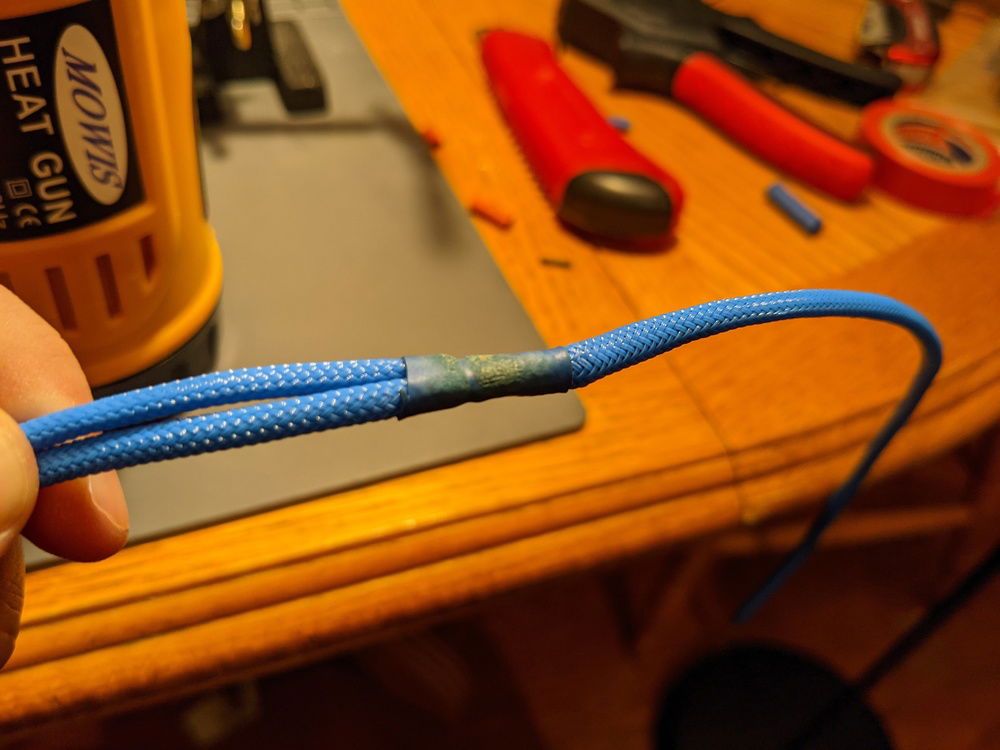 After sleeving each wire, I used heat shrink to try to melt the sleeves together a bit around the joint to help prevent them from sliding out.