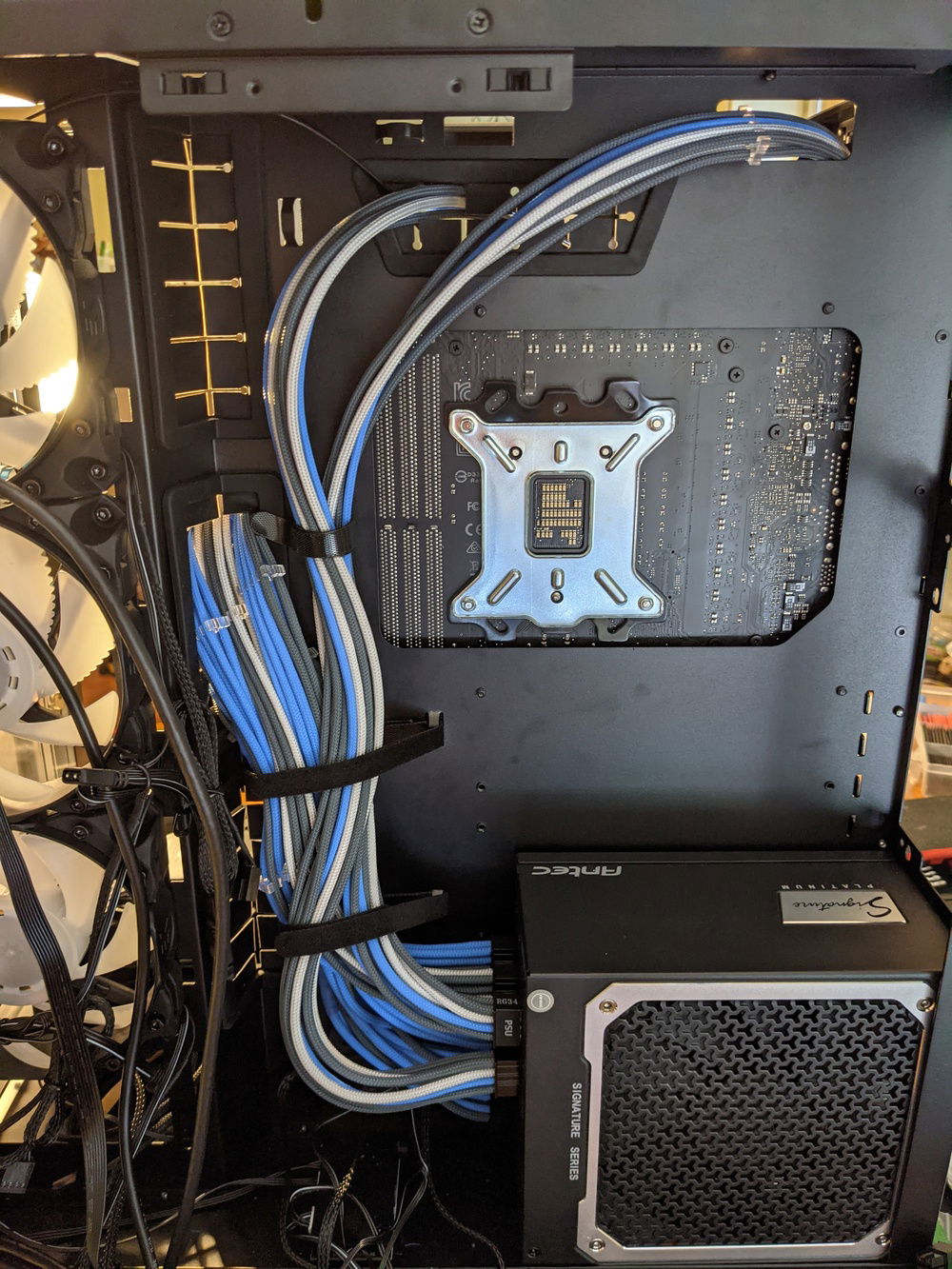 Cable management of the sleeved cables. Definitely a lot of cables to deal with, but much better than having to deal with the extra long stock cables.